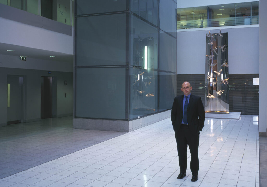 Business man in office atrium