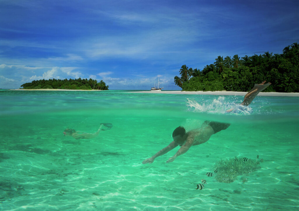 man diving underwater