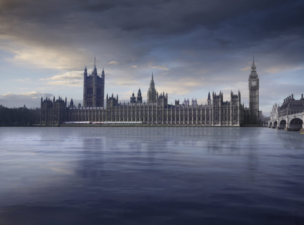 Parliament with dramatic sky and thames in foreground