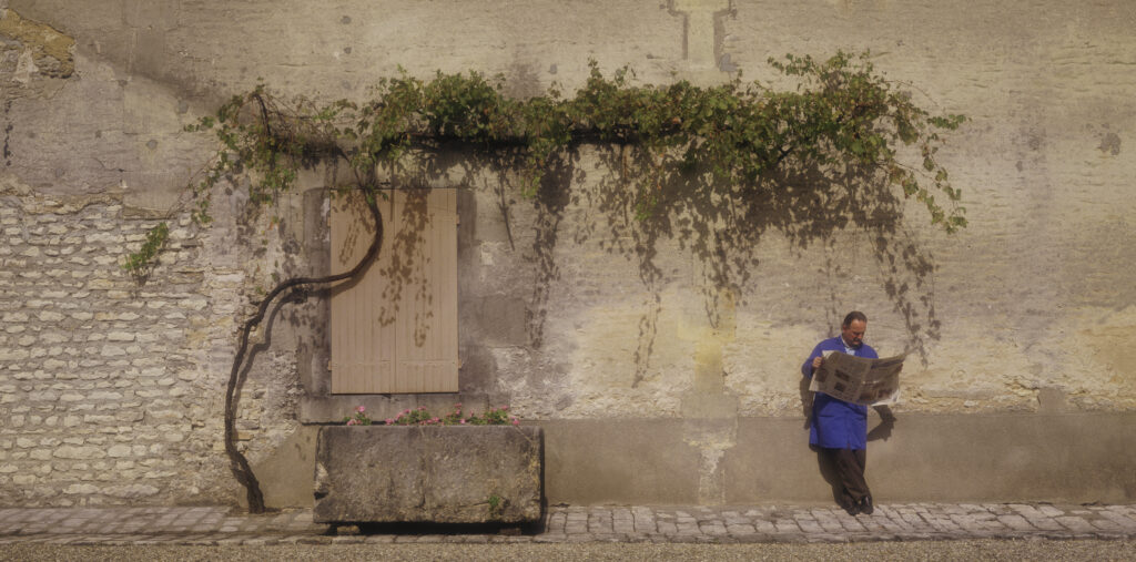 Camus worker, resting in courtyard