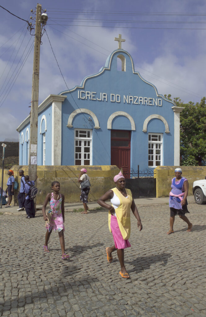 Ladies walking in front of church