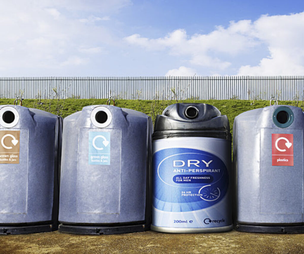 recycle centre with collection bins, one is an oversized deoderant can