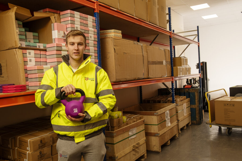 man with sport equipment in warehouse