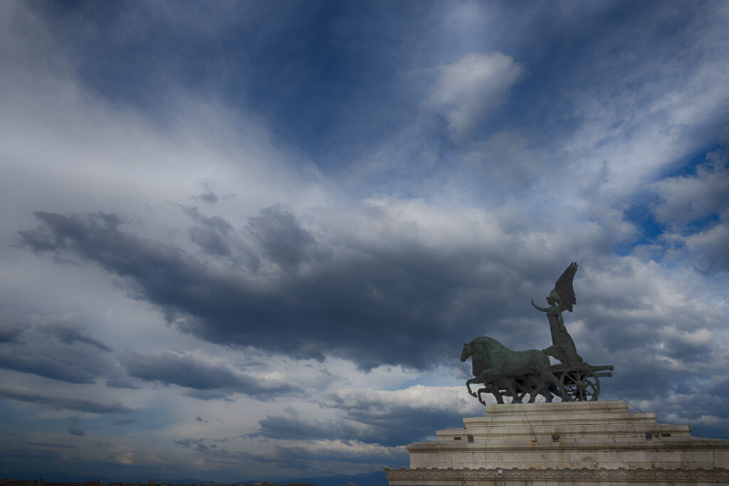 Statue of lady on Chariot with big sky