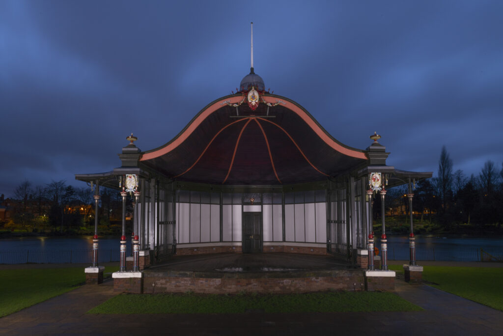 Nighttime image of Bandstand illuminated