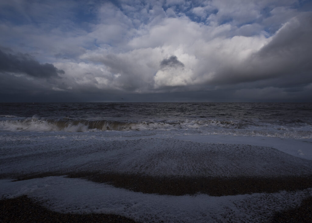 stormy sea shore with dramatic sky