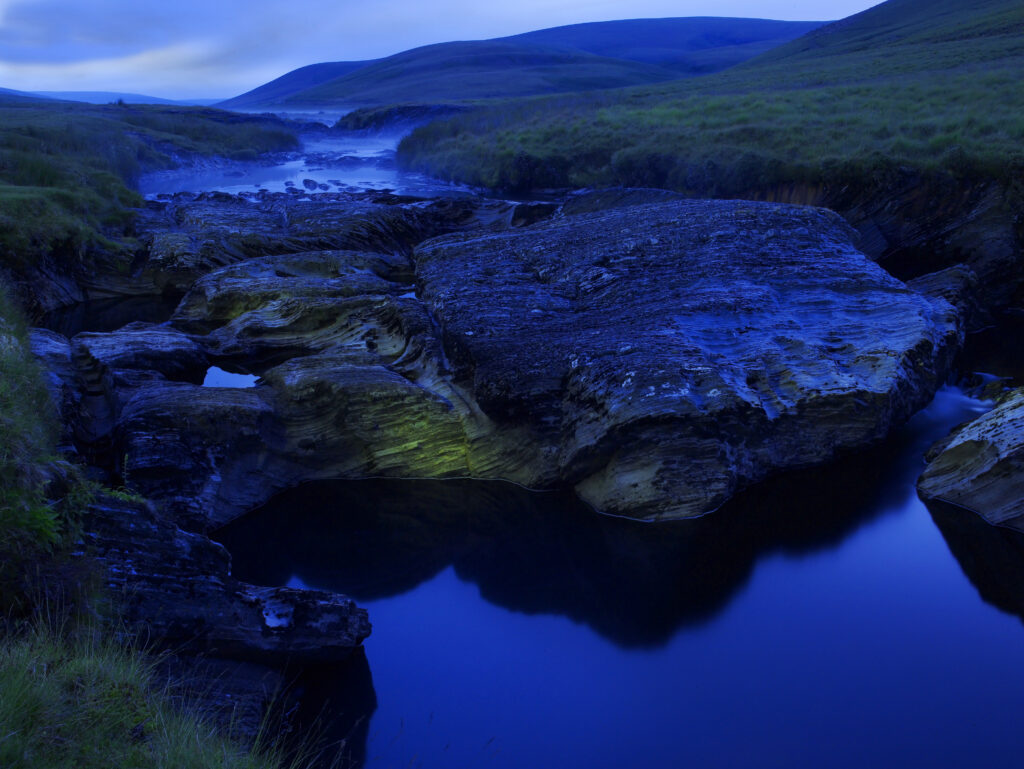 Elan flows through rock at head of the valley