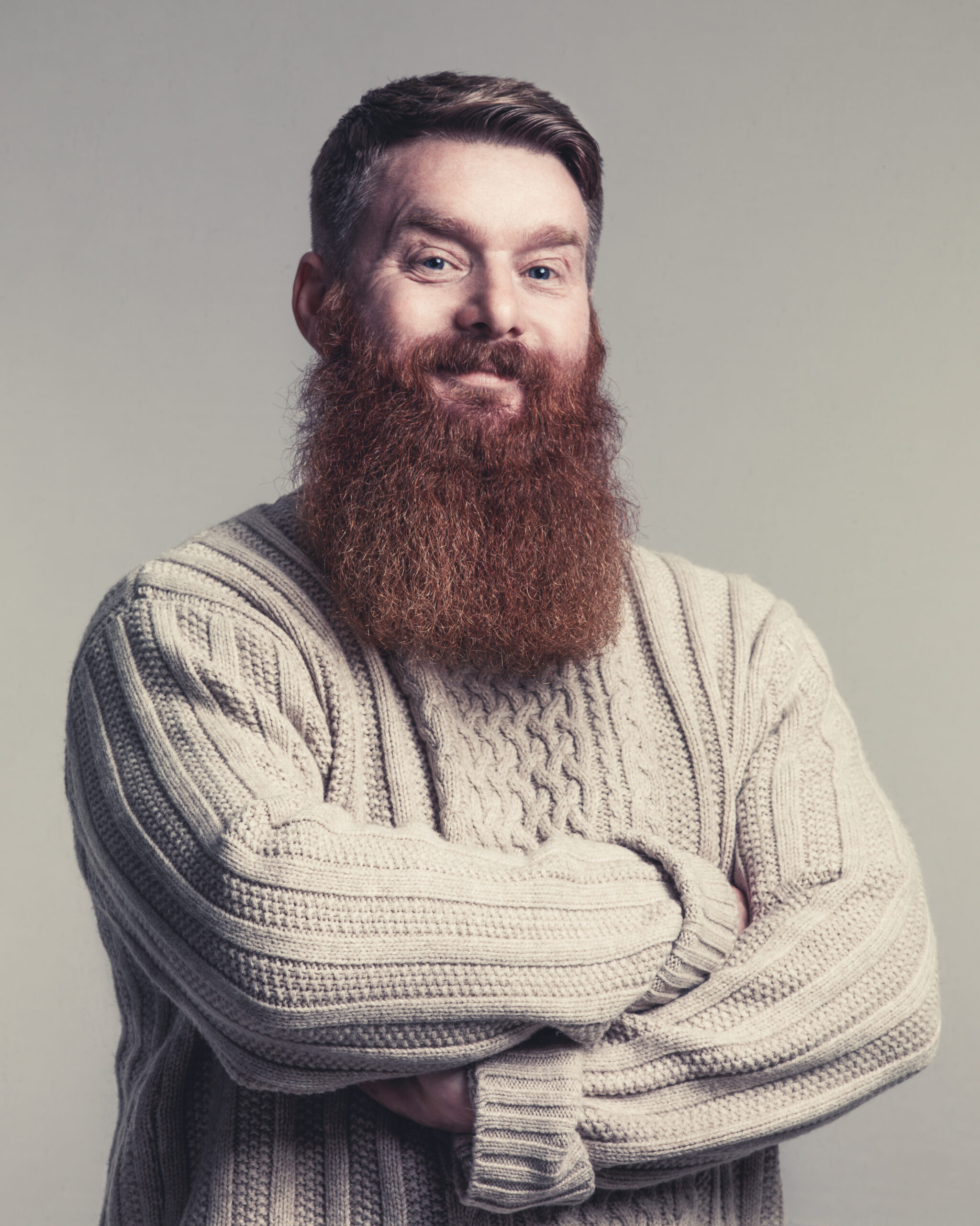 Bearded man in chunky jumper