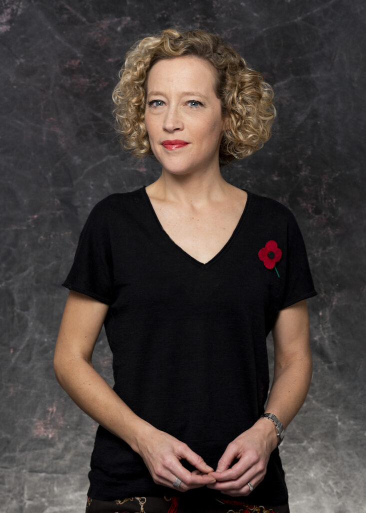 Cathy Newman in black dress looking to camera