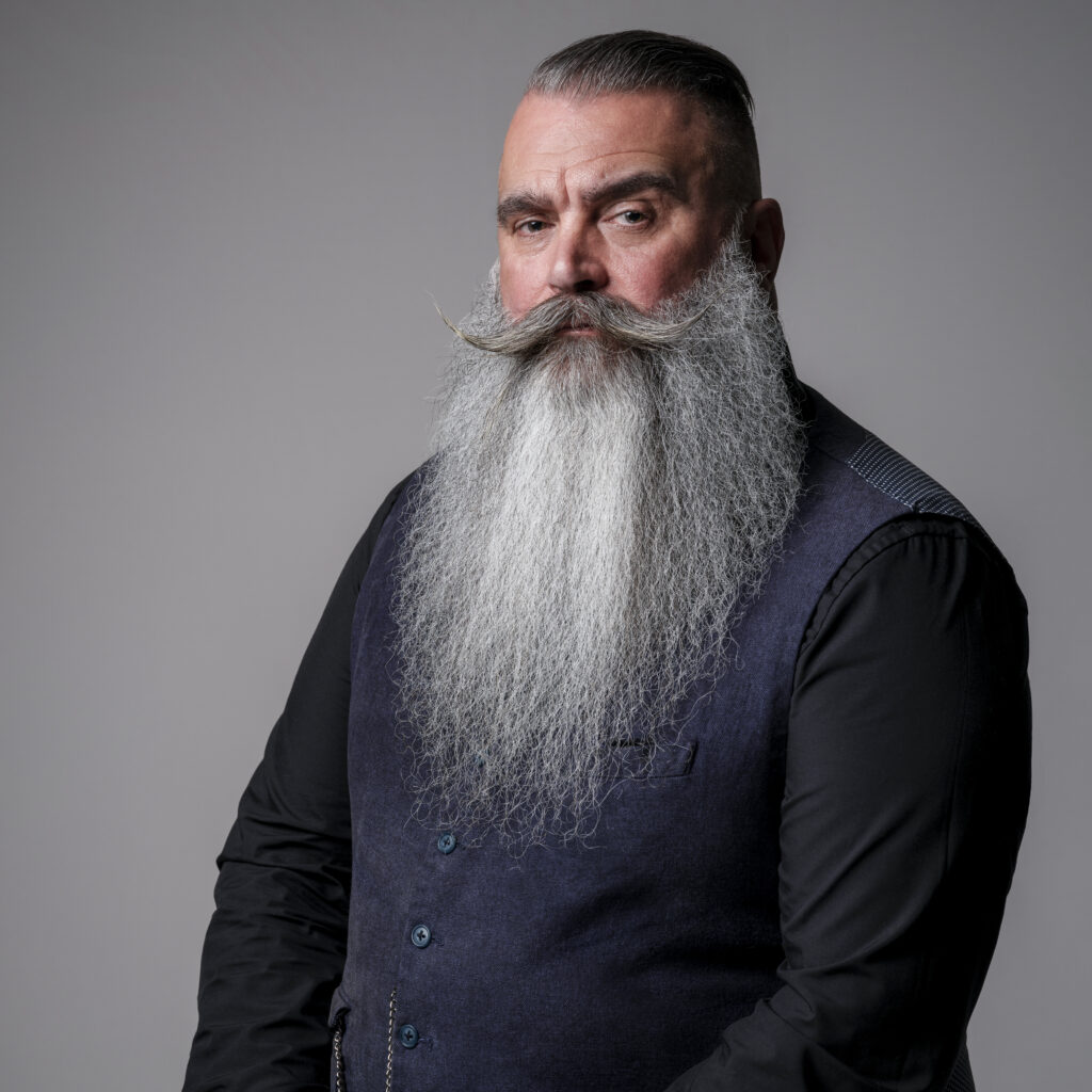 Man with long grey beard man. Photograph for the Marsh & Parsons brand campaign.