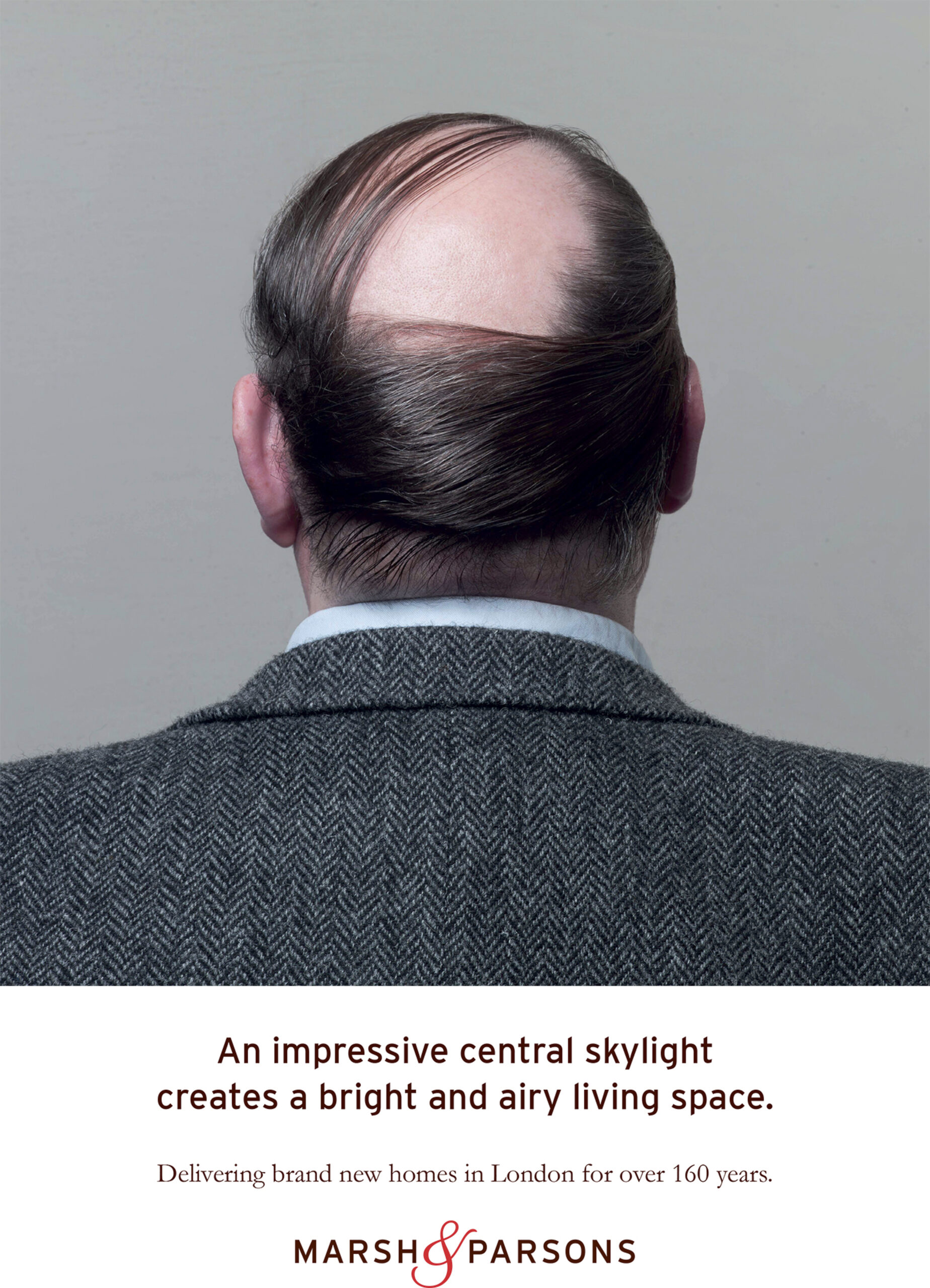 man with bald head, seen from behind- copy reads An impressive central skylight creates a bright and airy living space.