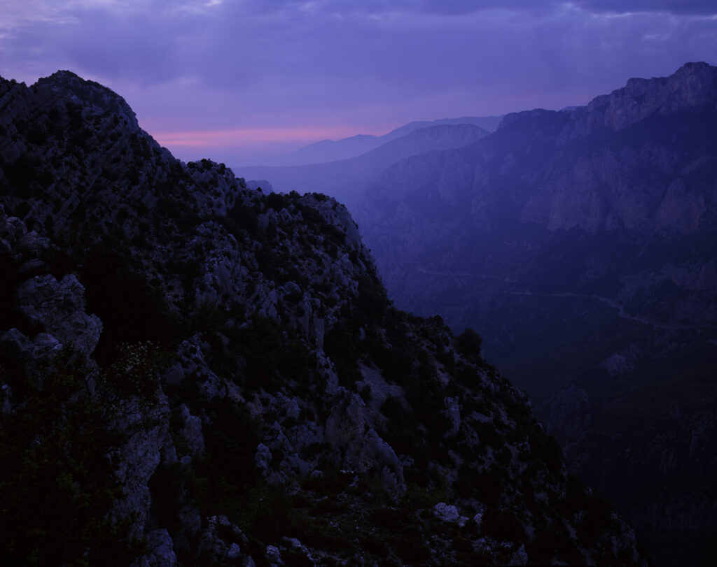 Mountain foreground with valley and more mountains in background,