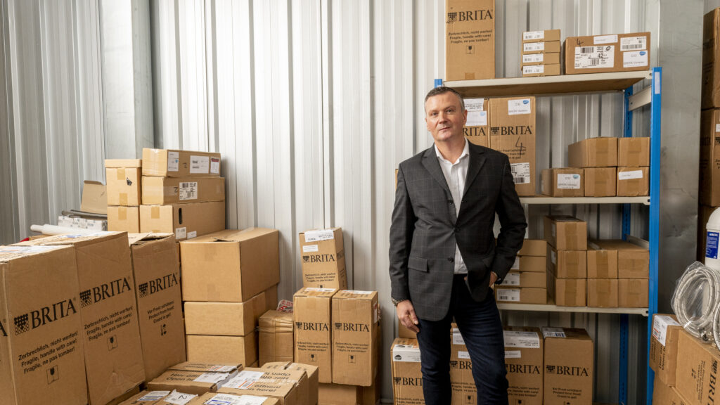 man in store unit with brita products