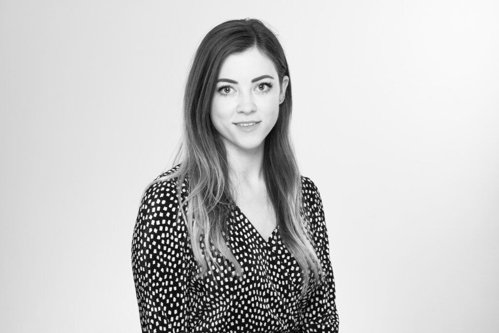 black & white headshot of young lady with brown eyes and dark hair