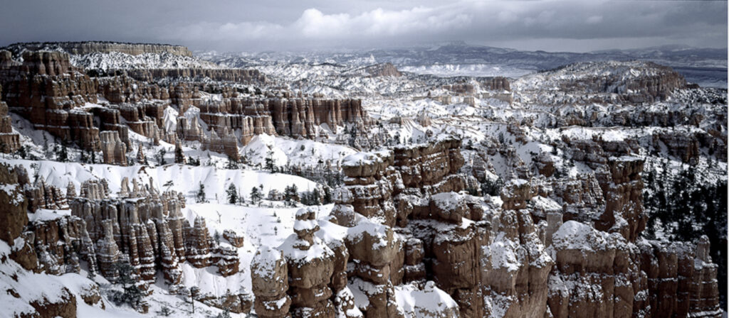 Snow covered Bryce Canyon with grey clouds