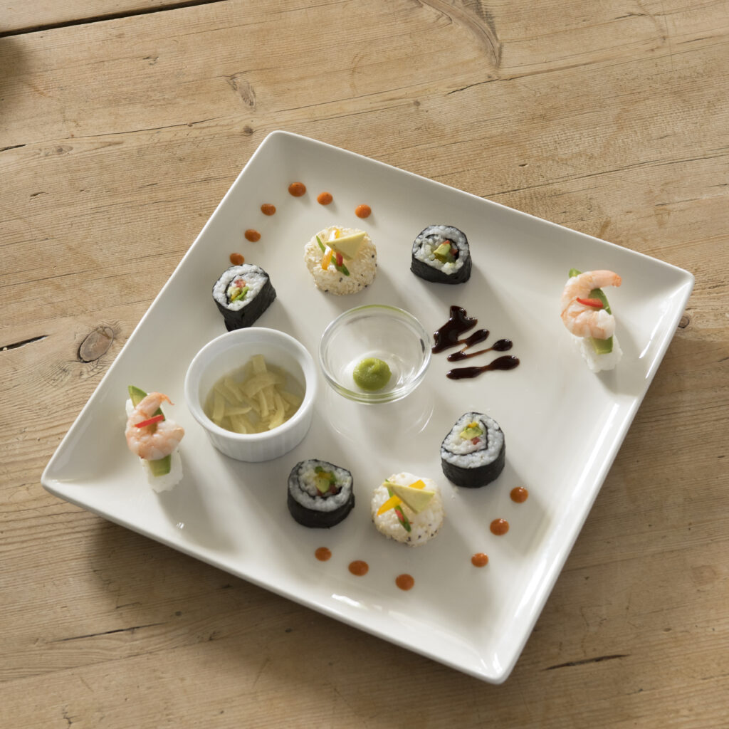 plate of Sushi with condiments in artistic arrangement