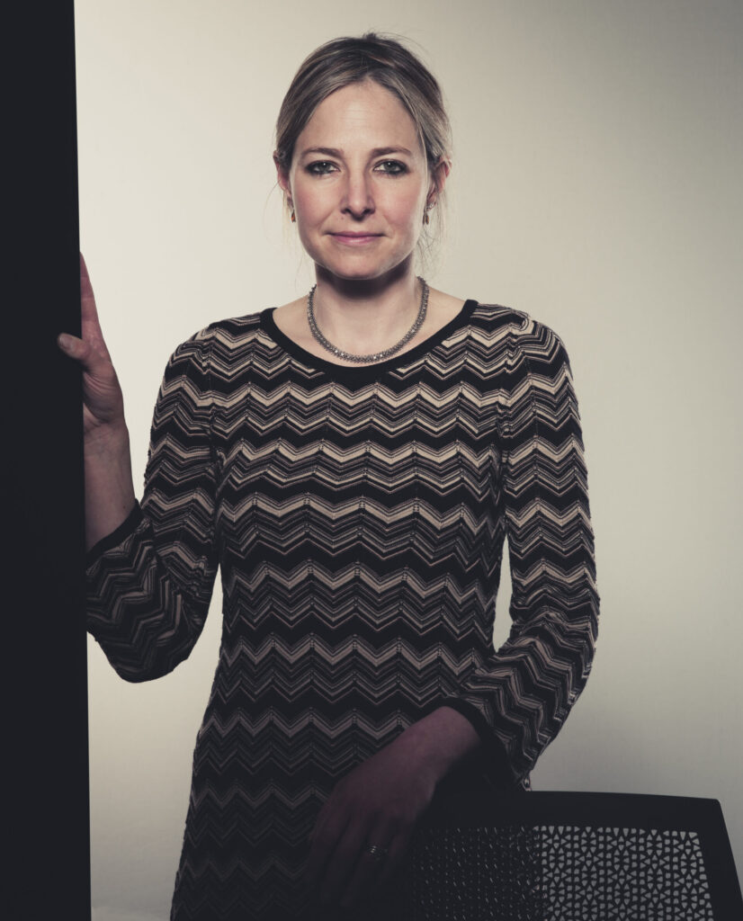 Alice Roberts - anthropologist - presenter in dress looking to camera