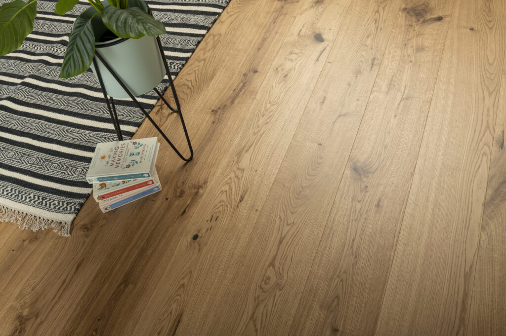 wooden floor with rug and books - showing quality of wood