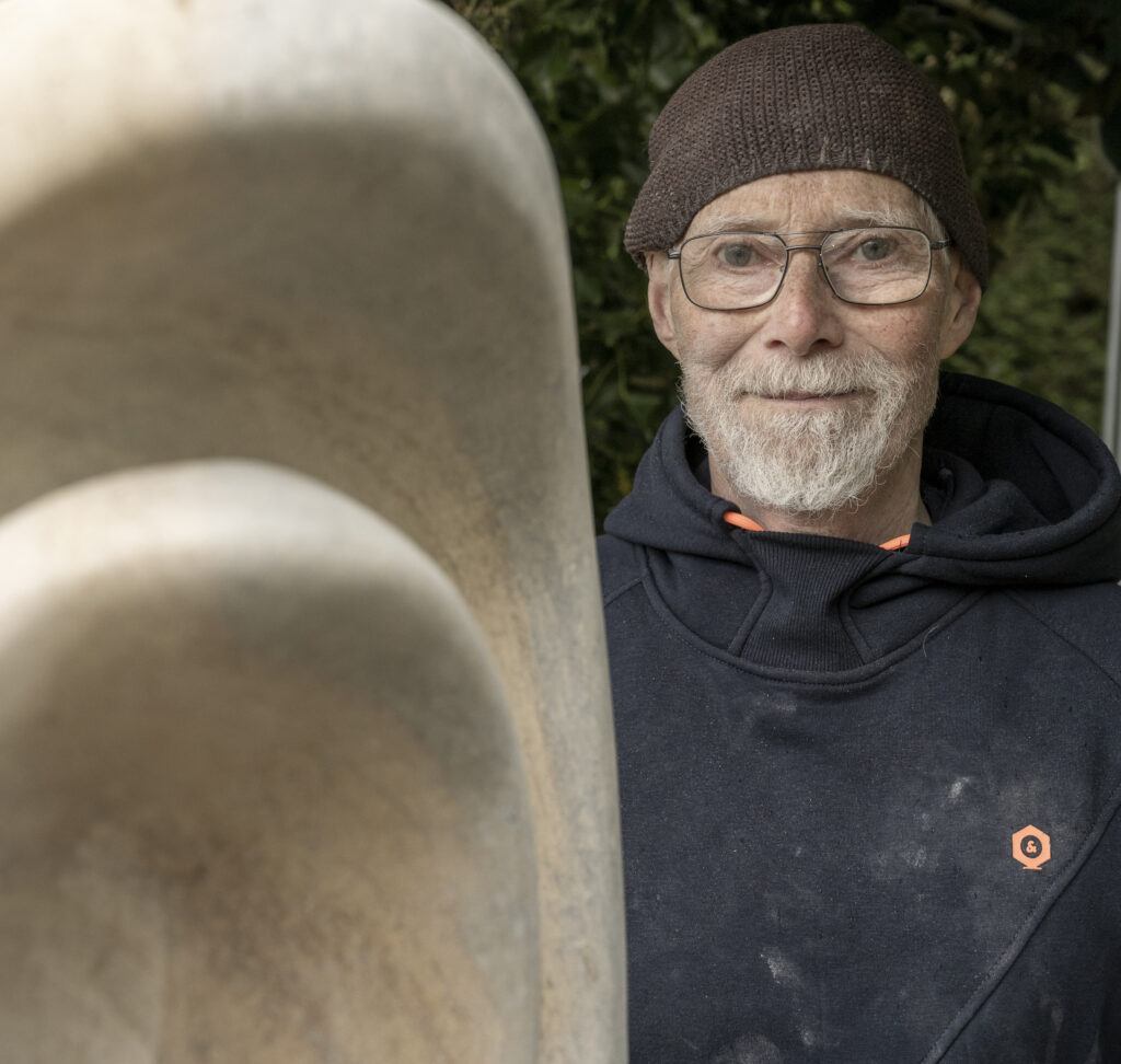 Martin Cash with sculpture in foreground
