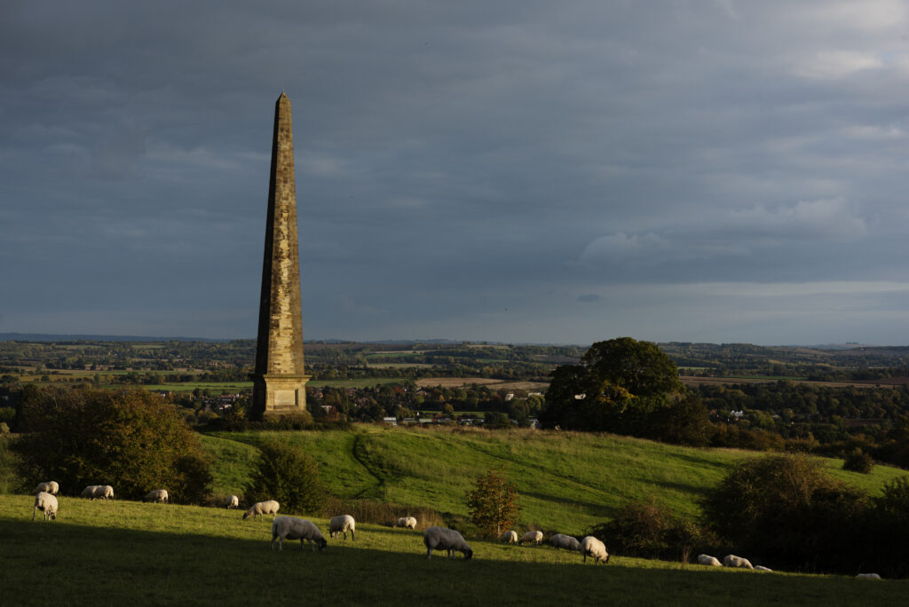 Obelisk on Hill with sheep overlooking the Vale of Stratford on Avon