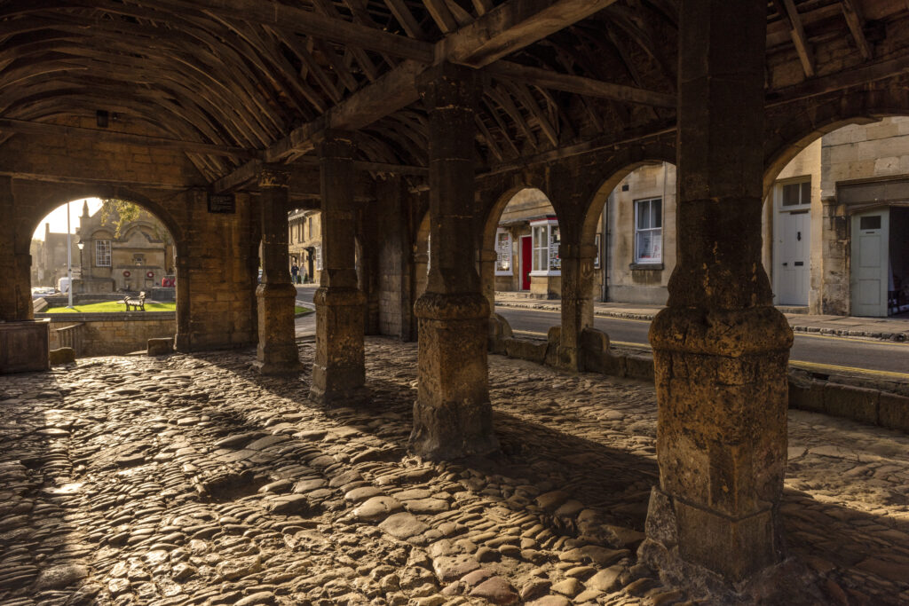 interiour of old market under open ceiling in Cotswold Town, old cobbles sun lit