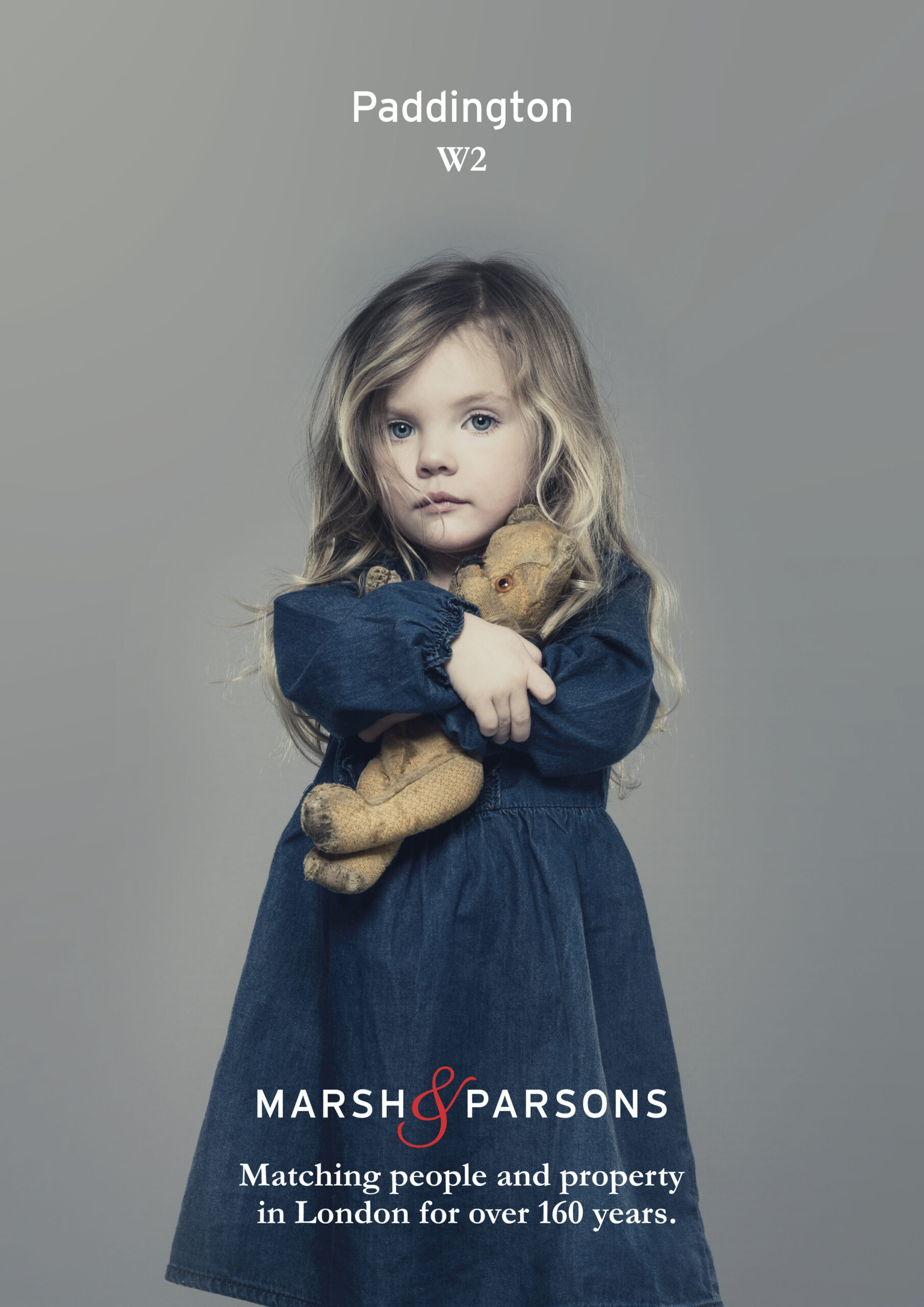 poster with girl holding teddy bear, caption say's Paddington - Brand - Marsh & Parsons
