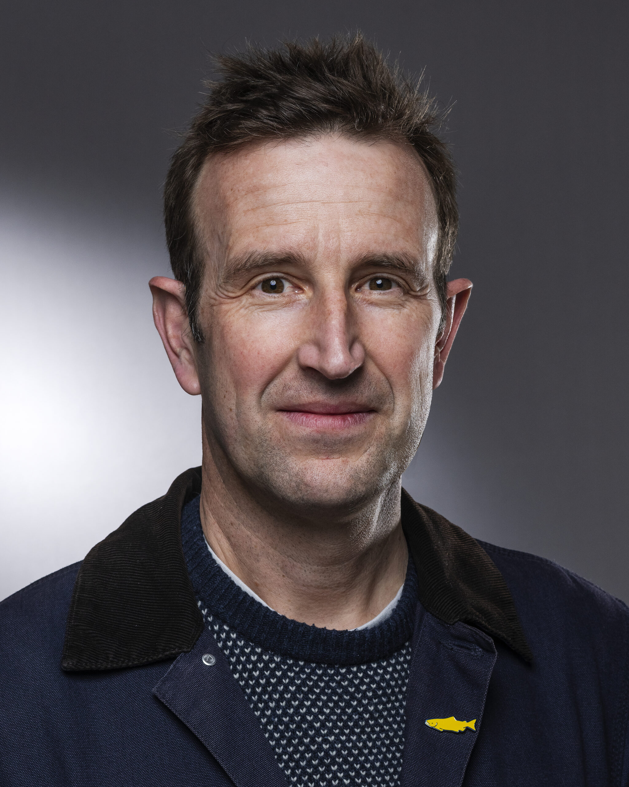 Author Robert Macfarlane headshot with light and dark backgrond