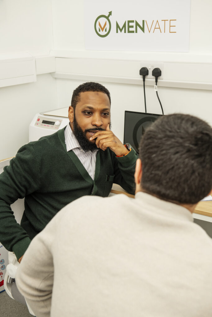 Dr listening to patient in clinic